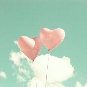 Two pink heart-shaped balloons