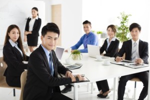 Group of happy young business people in  meeting