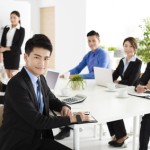 Group of happy young business people in  meeting