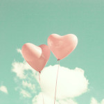 Two pink heart-shaped balloons