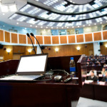 Speaker's table in conference room.