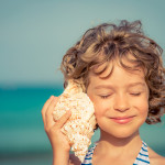 Child relaxing on the beach