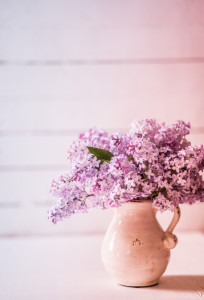 Bouquet of lilacs on wooden background