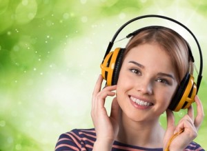 Music. Young woman listening to music